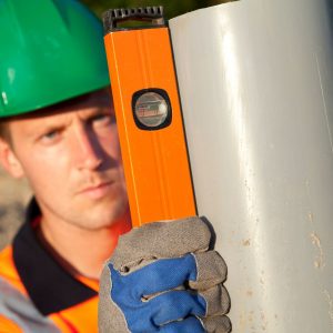 image of a plumber measuring something