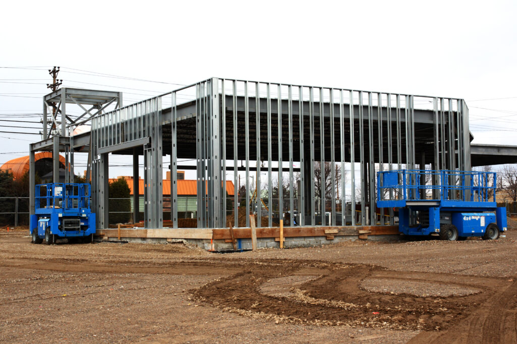 Plumbing Solutions LLC supporting large-scale commercial construction plumbing projects with industrial piping systems.