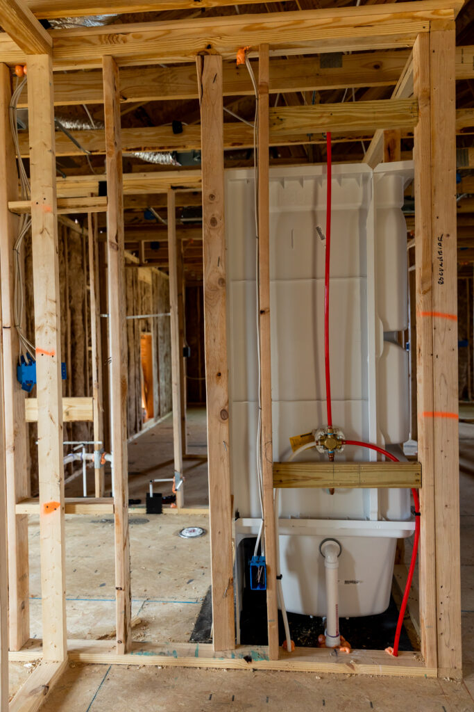 New bathtub and shower plumbing rough-in installed during a whole-house repiping project by Plumbing Solutions LLC.